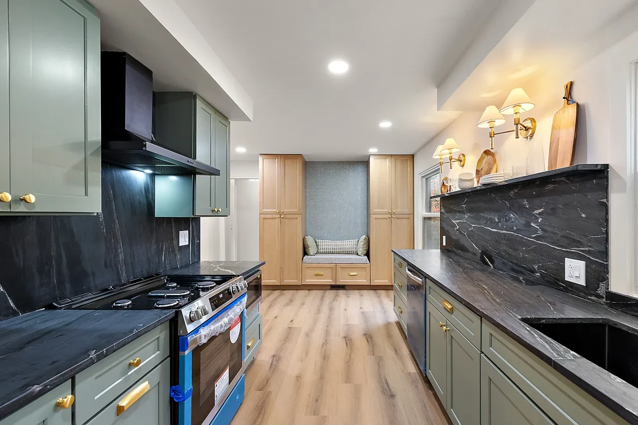 Woodland Project — modern kitchen with arched mirror and stairs