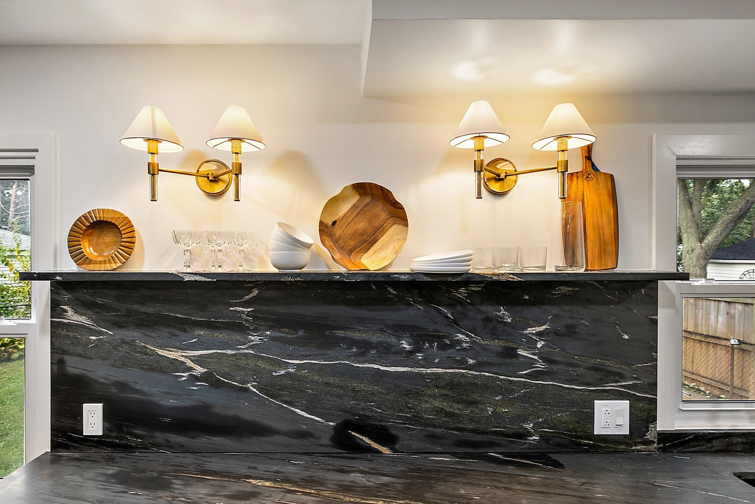 Woodland Project — modern kitchen black marble backsplash gold accents